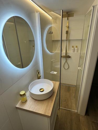 a bathroom with a sink and a shower at SuitePoolBarcelona in Vilassar de Dalt