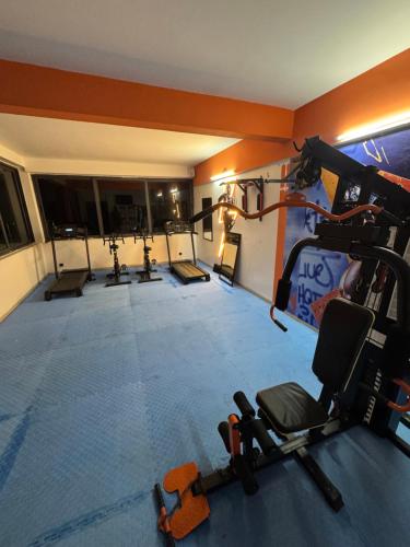 a gym with a bunch of equipment in a room at dwane in Dakar