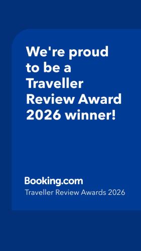 a blue sign that says were proud to be a traveller reviewagency winner at B&B Antica Dimora in Petacciato