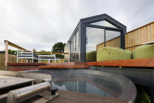 a swimming pool on the deck of a house at Old Mac Daddy in Botrivier