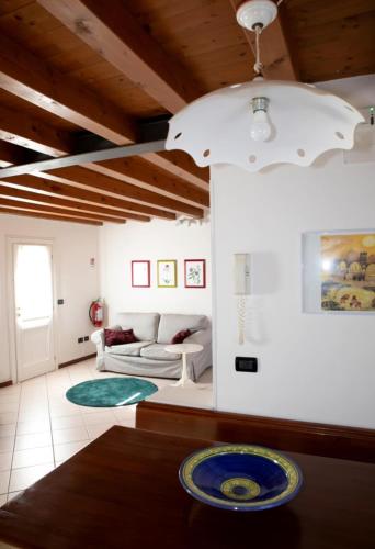 a living room with a couch and a table at A casa di Giò in Vittorio Veneto