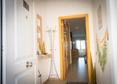a hallway with a door leading into a house at El Barro Colorao in Segura de León