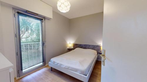 Llit o llits en una habitació de Le Cocon Royal