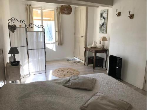 Llit o llits en una habitació de La Cigale Bleue