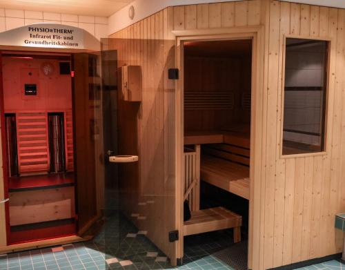 a sauna in a building with wooden walls at Hotel Dorfcafe Unken in Unken