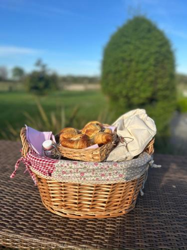 a basket of bread sitting on a table at Les Roulottes des Amis de Wonky in Rétaud