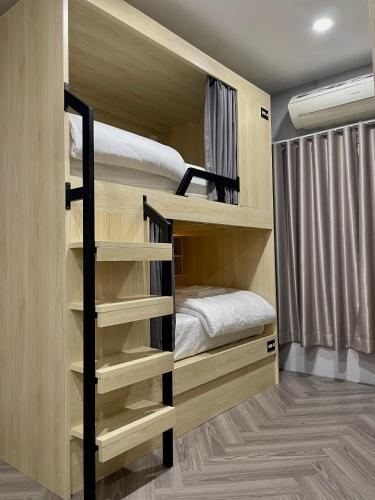 a bunk bed room with two bunk beds at Soulstay Bangkok in Bangkok