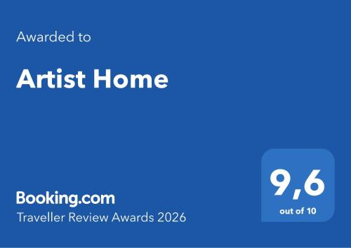 a blue background with the text awarded to an artist home at Artist Home in Porto Rafti