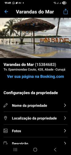 a page of a website with a picture of a tree at Varandas do mar II in Abade