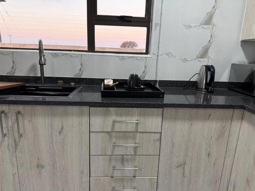Cuina o zona de cuina de BNG Suites 5