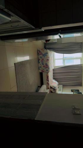 a small room with a bed and a window at Apartment in ajman in Ajman 