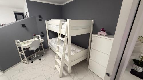 Apartment Aria tesisinde bir odada yatak veya yataklar