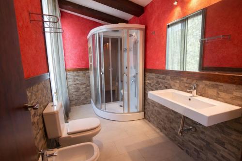 a bathroom with a shower and a sink and a toilet at Catalunya Casas An oasis for up to 26 nature loving guests! in Sils