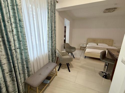 a bedroom with a bed and a bed and a window at visitor's house 4 in Rădăuţi
