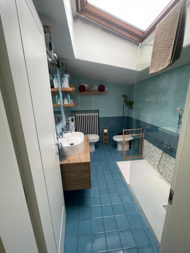 a bathroom with a sink and a toilet and a shower at San Clemente guest house in Padova