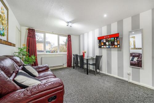 a living room with a couch and a table at RC10O Satisfying and Spacious stay in Central Station