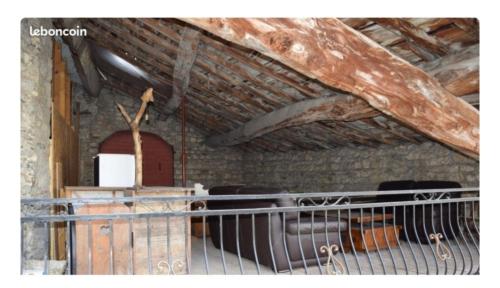 a room with a church with a wooden ceiling at Maison Terreaux in Vaux-en-Bugey
