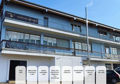 a building with a fence in front of it at CROWN LIVING Babylon Studios Lustenau - Studios nahe Messe und Schweizer Grenze, WLAN, kostenloser Parkplatz, Self Check-in, ideal für Geschäftsreisende und Feriengäste in Lustenau