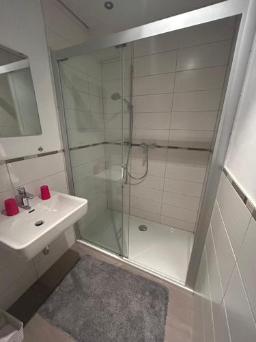 a bathroom with a shower and a sink at Gasthof Vogelleitner in Sankt Aegyd am Neuwalde