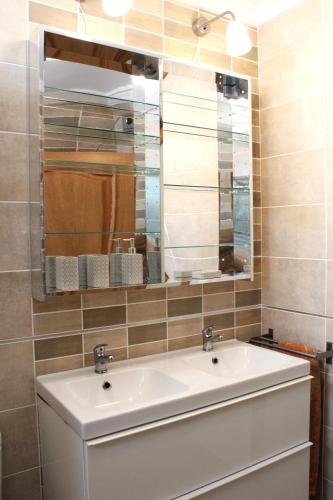 a bathroom with a sink and a mirror at Villa Sol in Roquetas de Mar