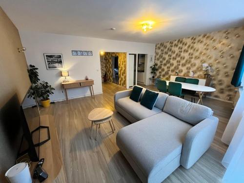 a living room with a couch and a table at Vilvoorde city center in Vilvoorde