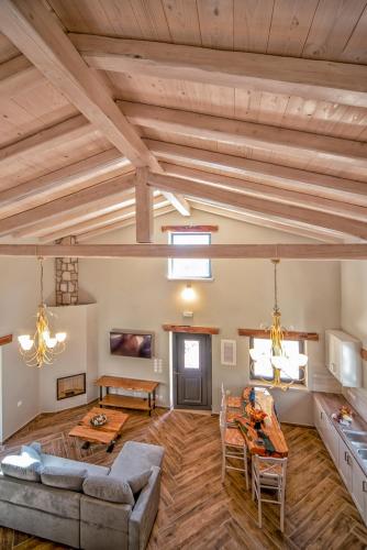 a living room with a couch and a table at Villa Dias by Elayan Villas Corfu in Karousádes