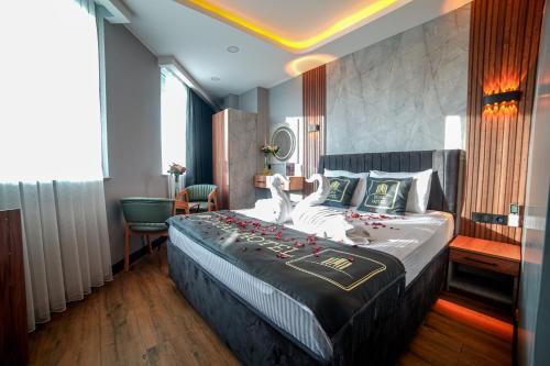 a bedroom with a large bed in a room at Dual Hotel Halkalı in Istanbul
