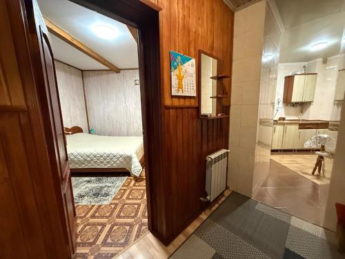 a hallway with a room with a bed and a door at healing waters in Skhidnitsa