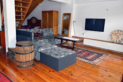 a living room with a couch and a table at Apartmani Memory in Višegrad