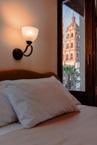 Katil atau katil-katil dalam bilik di Hotel Roma