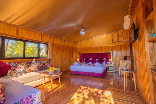 a living room with a bed and a couch at Maison safou in Marrakesh