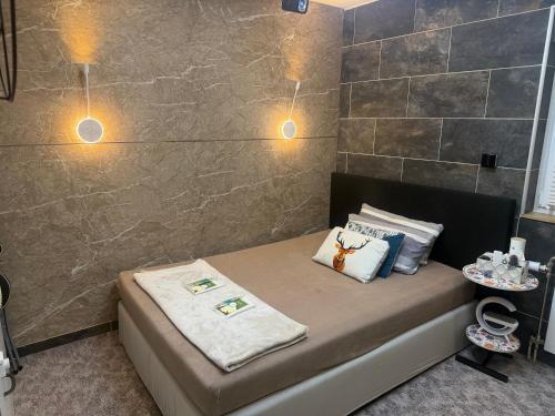 a bedroom with a bed with two pillows on it at WKI Company in Mannheim