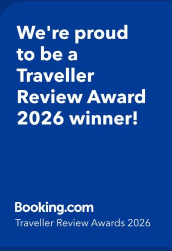 a blue sign that says were proud to be a traveler review award winner at Casa Angelina -Humanitas- Forum Assago-private Parking in Rozzano
