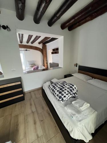a bedroom with a bed and a large mirror at DAISY Air Conditioning - Free Parking - WiFi - Self Check-in in Bergamo