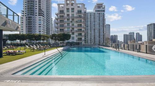 a large swimming pool on the roof of a building at Cadenza Miami - Luxury Residences in Miami