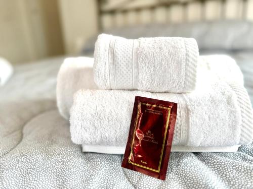 a pile of towels sitting on top of a bed at Italy House in Ladispoli