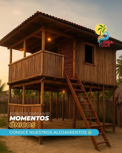 a wooden house with a staircase in front of it at Islas de San Blas habitacion en Narasgandub in Mamartupo