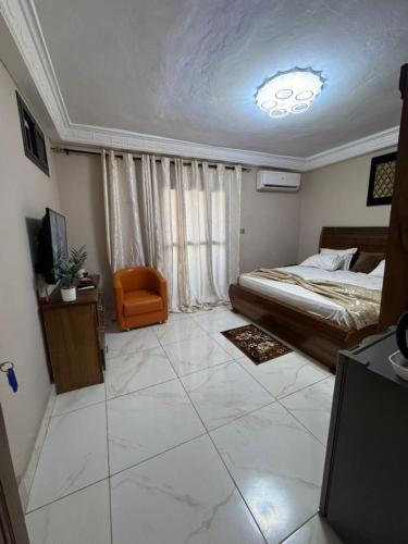 Llit o llits en una habitació de Résidence H SANGOI