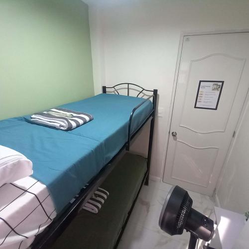 a hospital room with a bed and a camera at Tanza, Cavite Transcient House near SM in Tanza