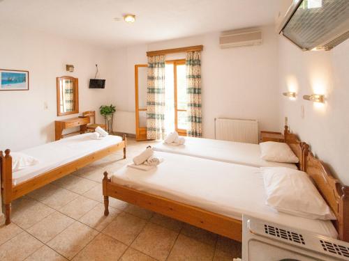 Ένα ή περισσότερα κρεβάτια σε δωμάτιο στο LAURA Skiathos