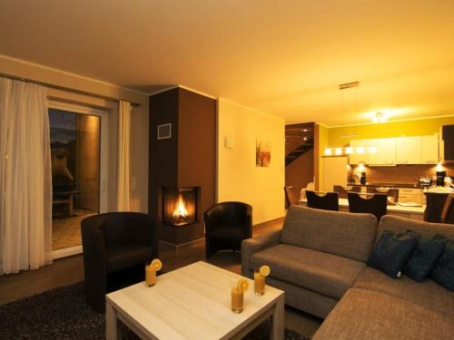 a living room with a couch and a table at Casa Leonardo in Göhren-Lebbin