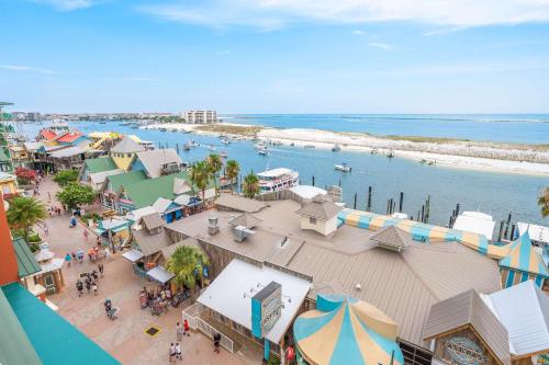 an overhead view of a beach with people and buildings at Where the Harbor Wakes For 6 in Destin
