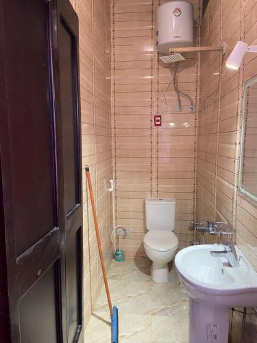 a bathroom with a toilet and a sink at Baywatch Camp in Nuweiba