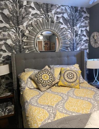 a bedroom with a bed with a mirror above it at The Zoo - This is it! in Saugatuck