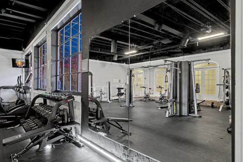 a gym with several treadmills and machines at Lux Mins To Atrium Health and Downtown Airport in Charlotte