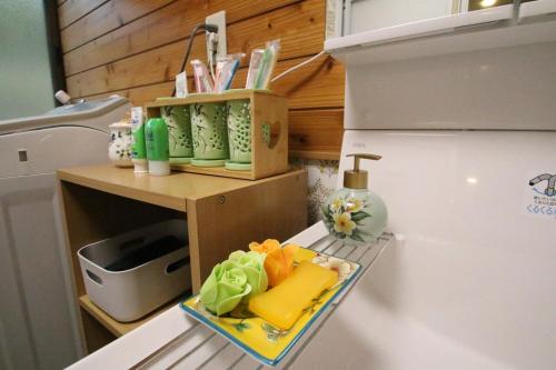 a refrigerator with a tray of food on top of it at 蝶自来 in Yamaga