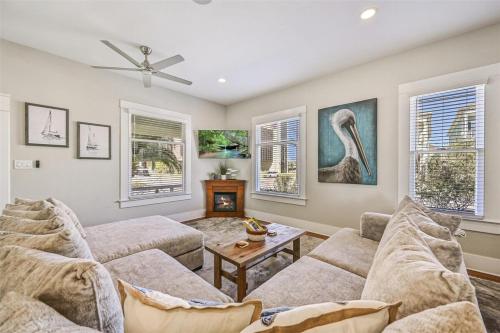 a living room with two couches and a fireplace at Magnolia Manor Heated Pool Coming Early 2026 in Galveston