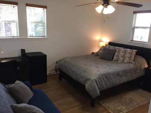 a bedroom with a bed and a ceiling fan at Cozy Bedroom Convenient Location in Bethesda