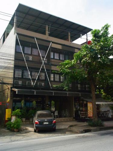 a car parked in front of a building at VX The Fifty in Bangkok
