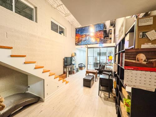 an office with a staircase in a building at Comfort West Urban Chicago loft house in Chicago